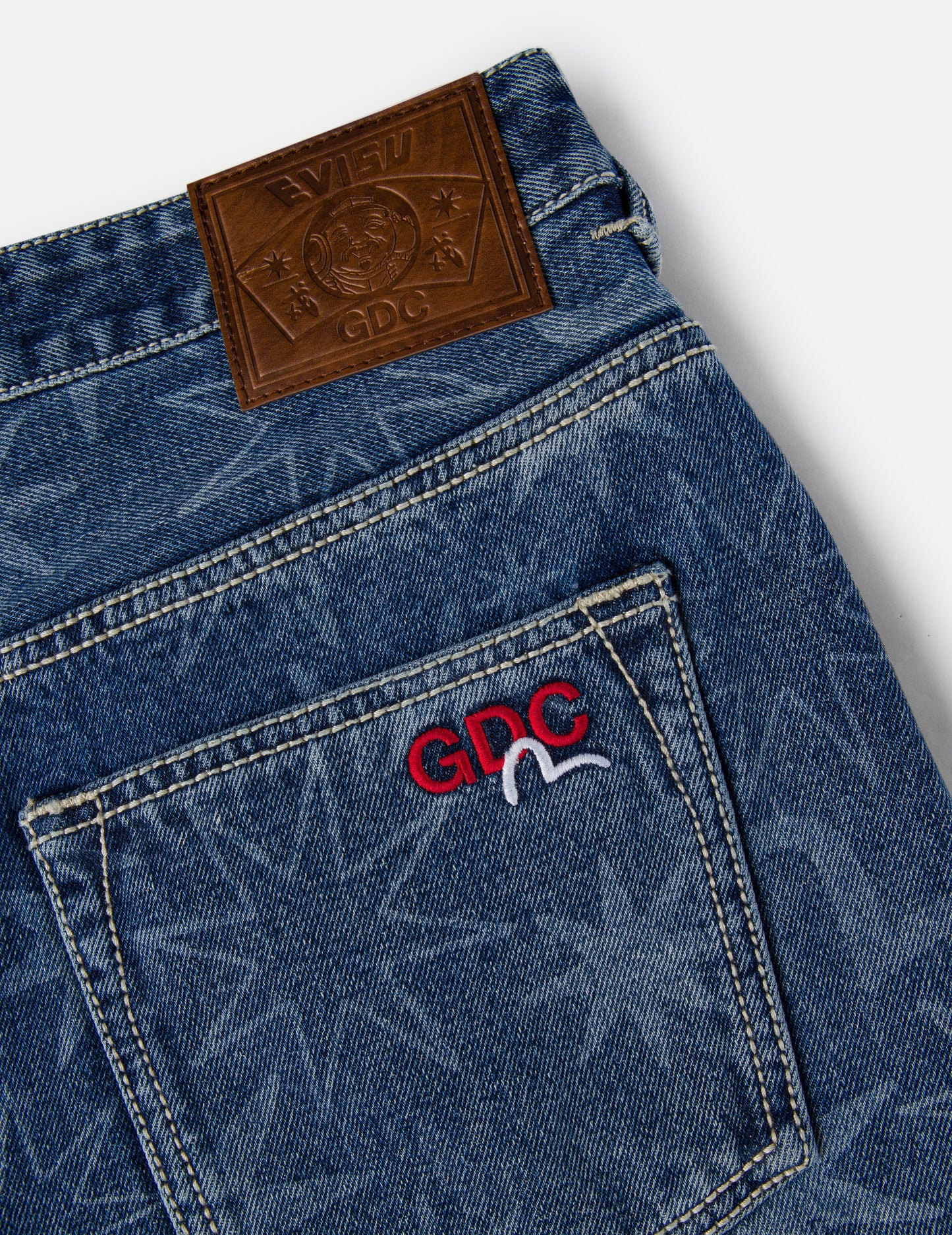 EVISU X GDC 滿地洗水印花寬版休閒牛仔褲